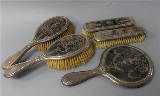 An Edwardian five piece silver and tortoiseshell pique brush and mirror set, Birmingham, 1907/8.